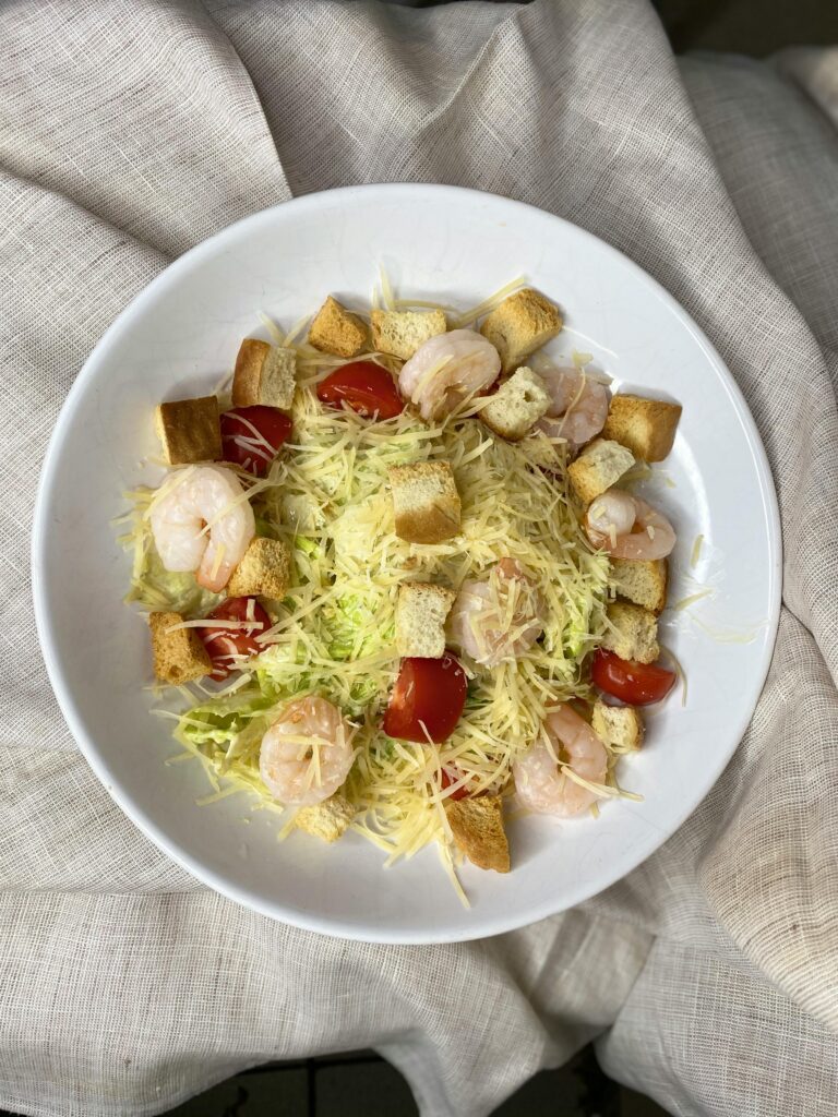 Shrimp Caesar Salad with Croutons and Fresh Lettuce