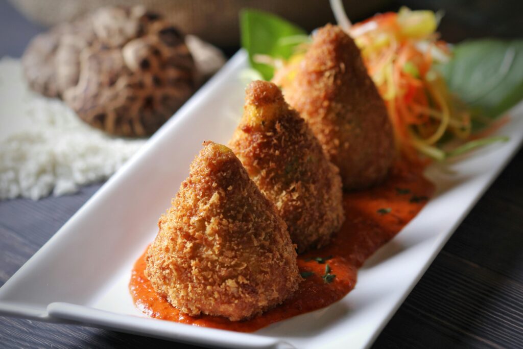 Crispy Arancini: Golden Italian Rice Balls with Tangy Tomato Sauce