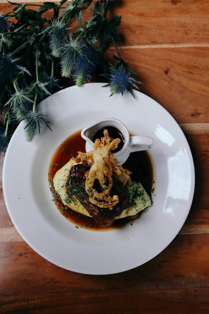 Beef Bourguignon with Crispy Onions and Herbs